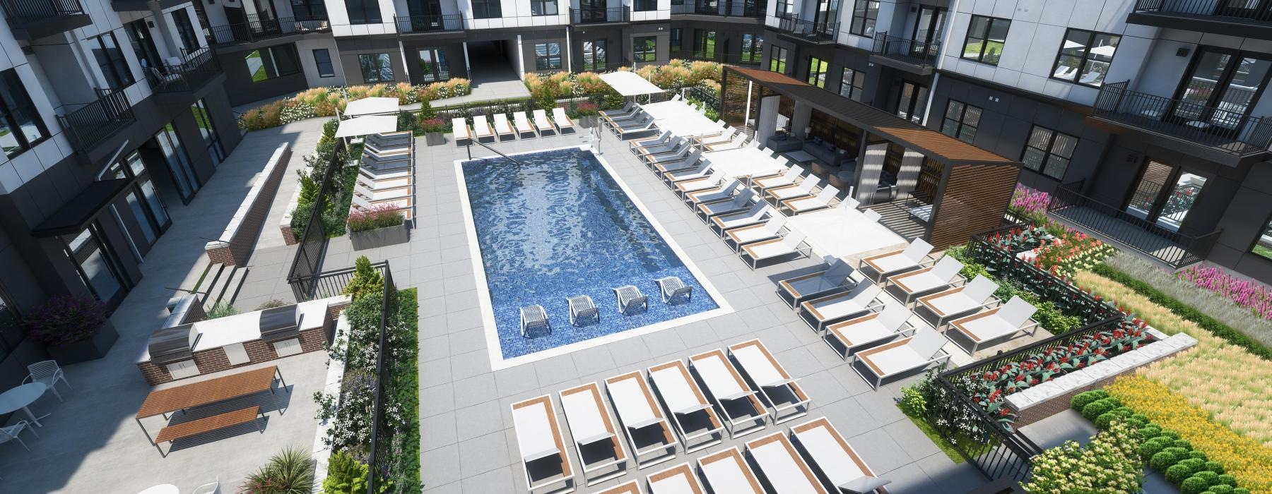 a courtyard with a pool and buildings